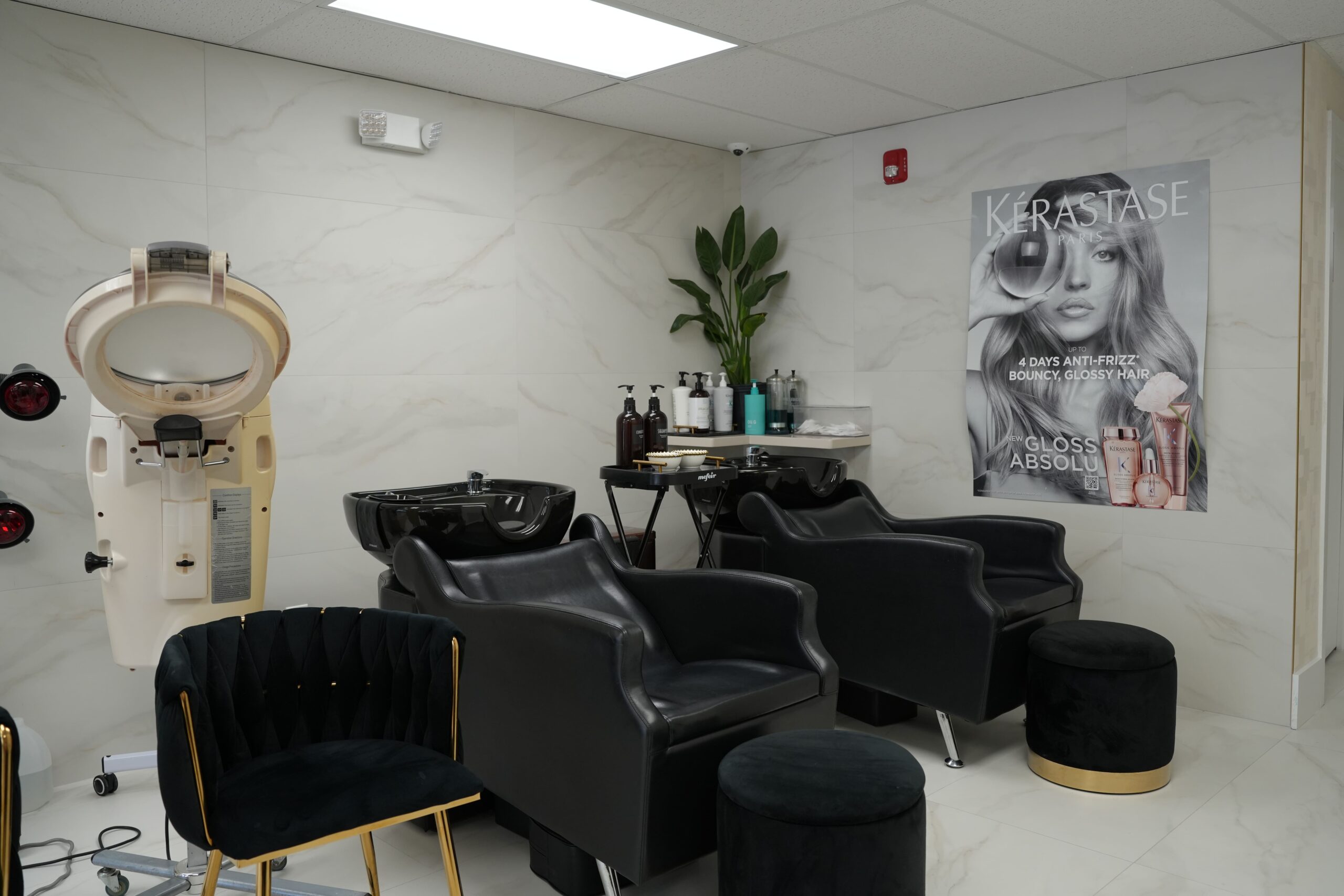 Hairdressing stylist working on a client’s hairstyle at TO Beauty Salon